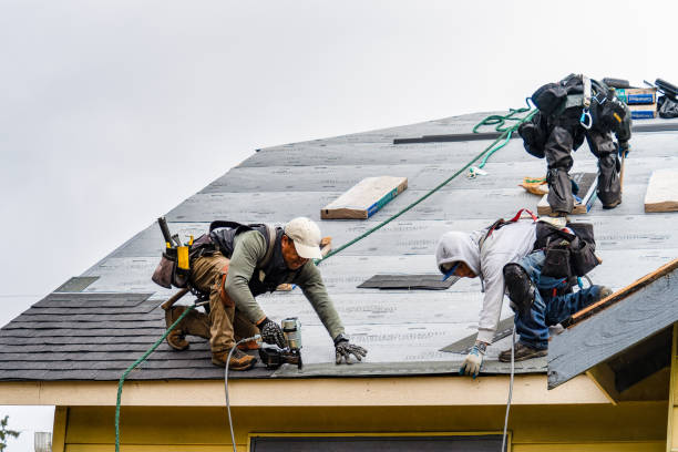 Professional Roofing technician working in Wyandanch, NY